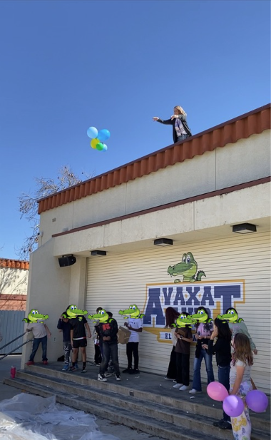 The Principal throws contraptions holding eggs off the roof to see if they will protect the egg.